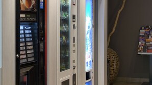 A vending machine area with a Nescafé machine and a beverage dispenser. - Cyan Hotel Roissy Villepinte Parc Des Expositions (Villepinte)