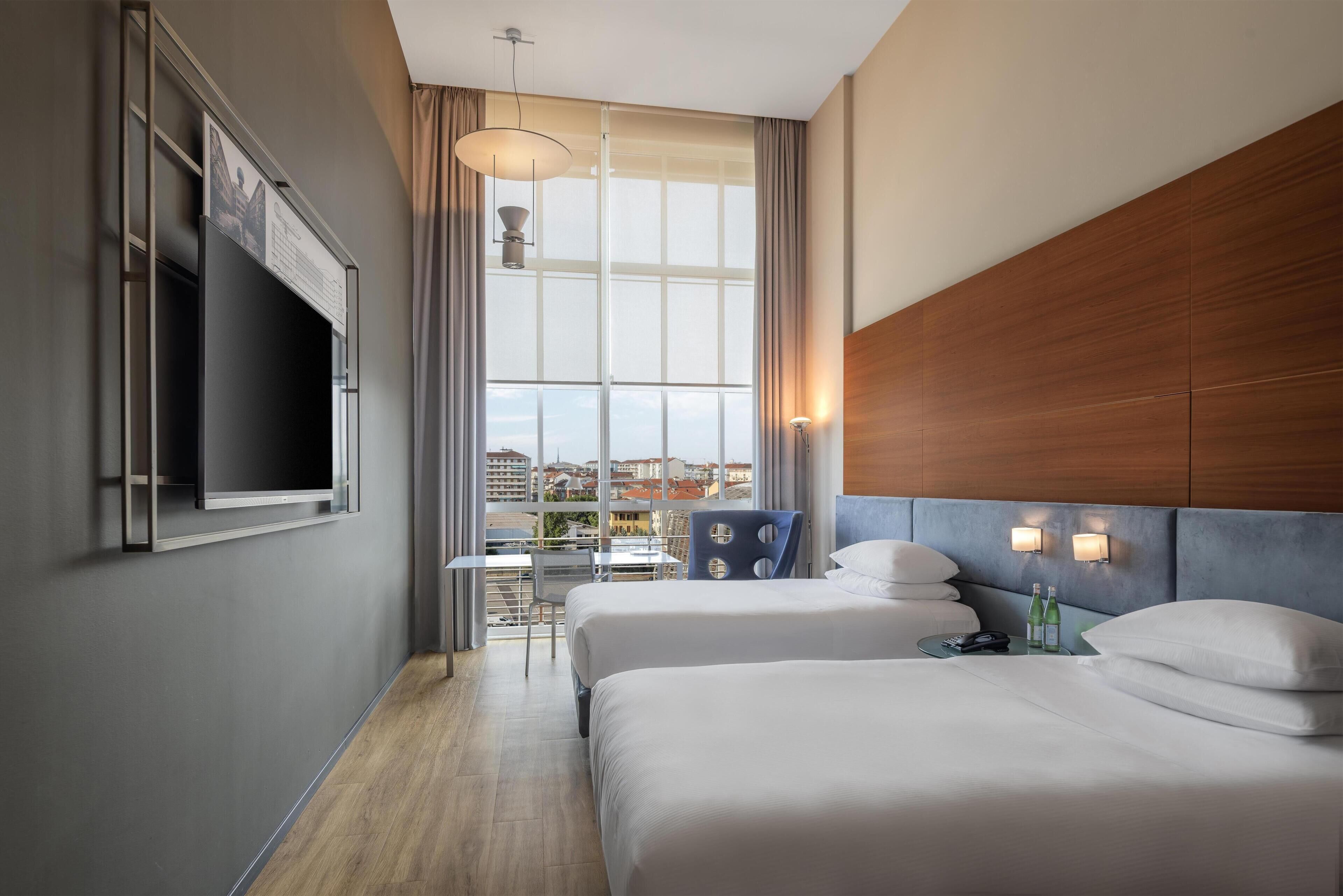 Hypo-allergenic bedding, down duvets, minibar, in-room safe