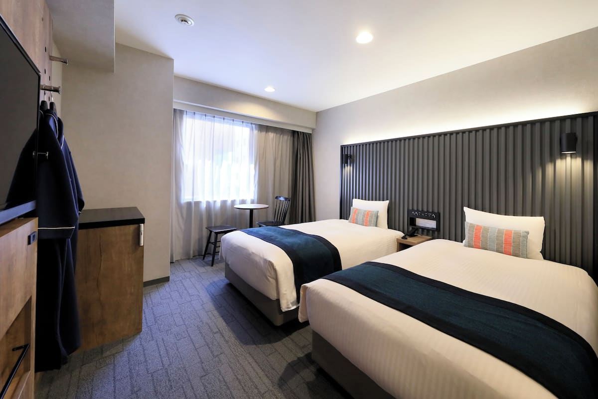 20 Sqm, Deluxe Twin Room (Bed Type: Single bed is arranged)