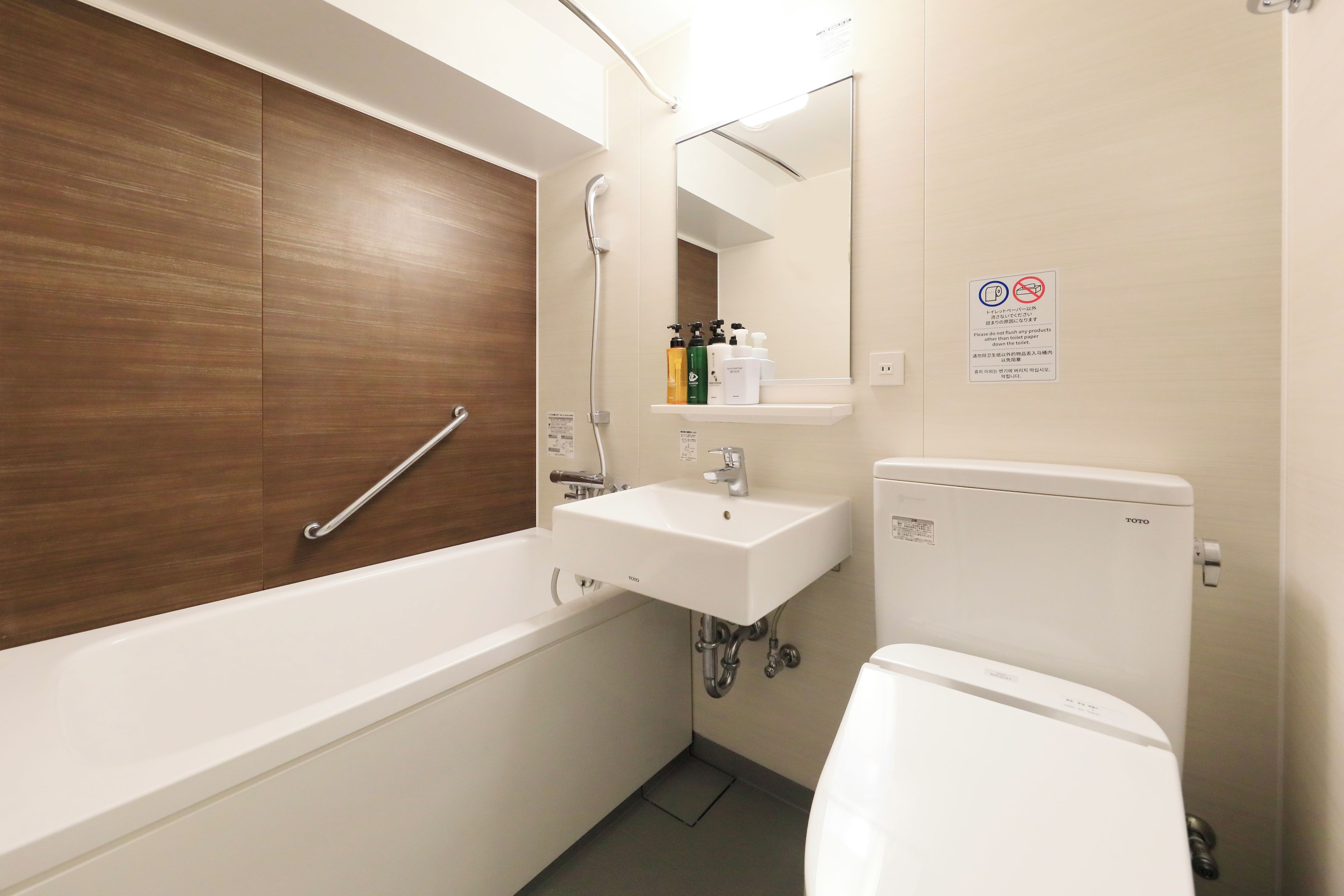 A bathroom with a bathtub, a sink, and a toilet.