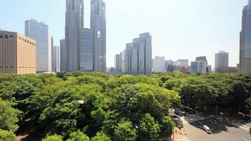 A cityscape with high-rise buildings and a crosswalk.