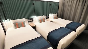 A hotel room with two beds, a nightstand, and a control panel.