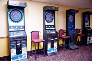 Experience the thrill of classic arcade games with our vintage dartboards, featuring interactive controls and a challenging target.