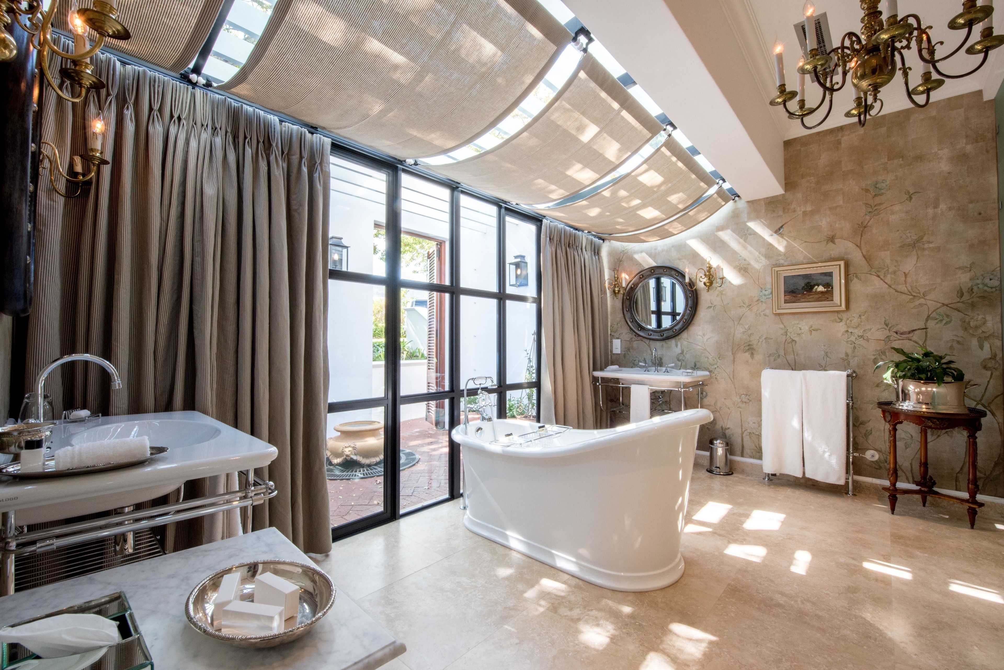 classic room | bathroom | separate bathtub and shower, rainfall showerhead, free toiletries