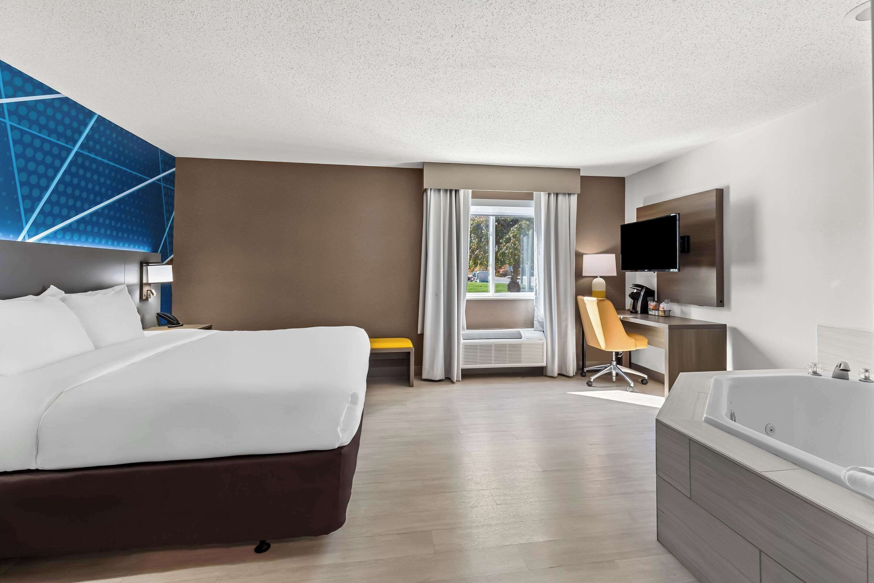 room, 1 king bed, accessible, non smoking | in-room safe, desk, blackout curtains, iron/ironing board