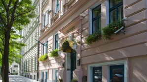 A row of classic European-style buildings with uniform facades, large windows, and decorative moldings. - Anna Hotel (Prague)