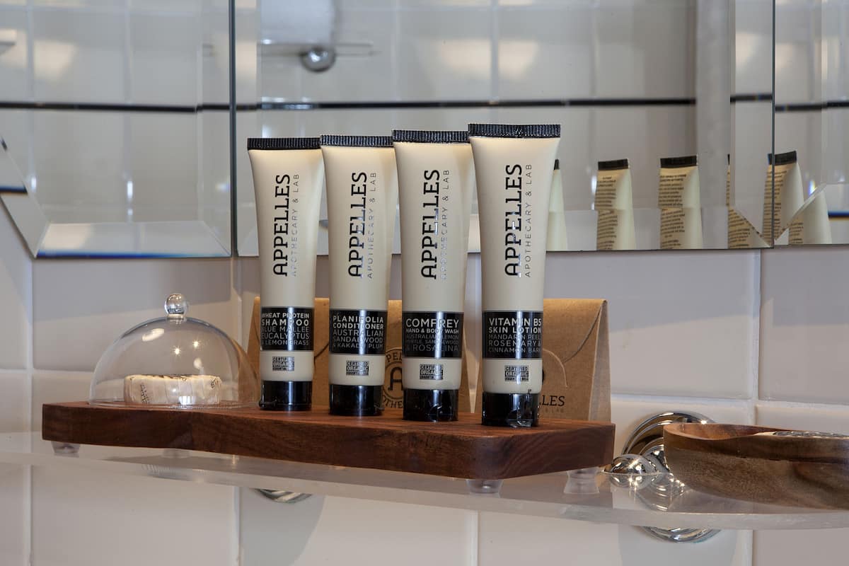 designer toiletries, hair dryer, bathrobes, towels