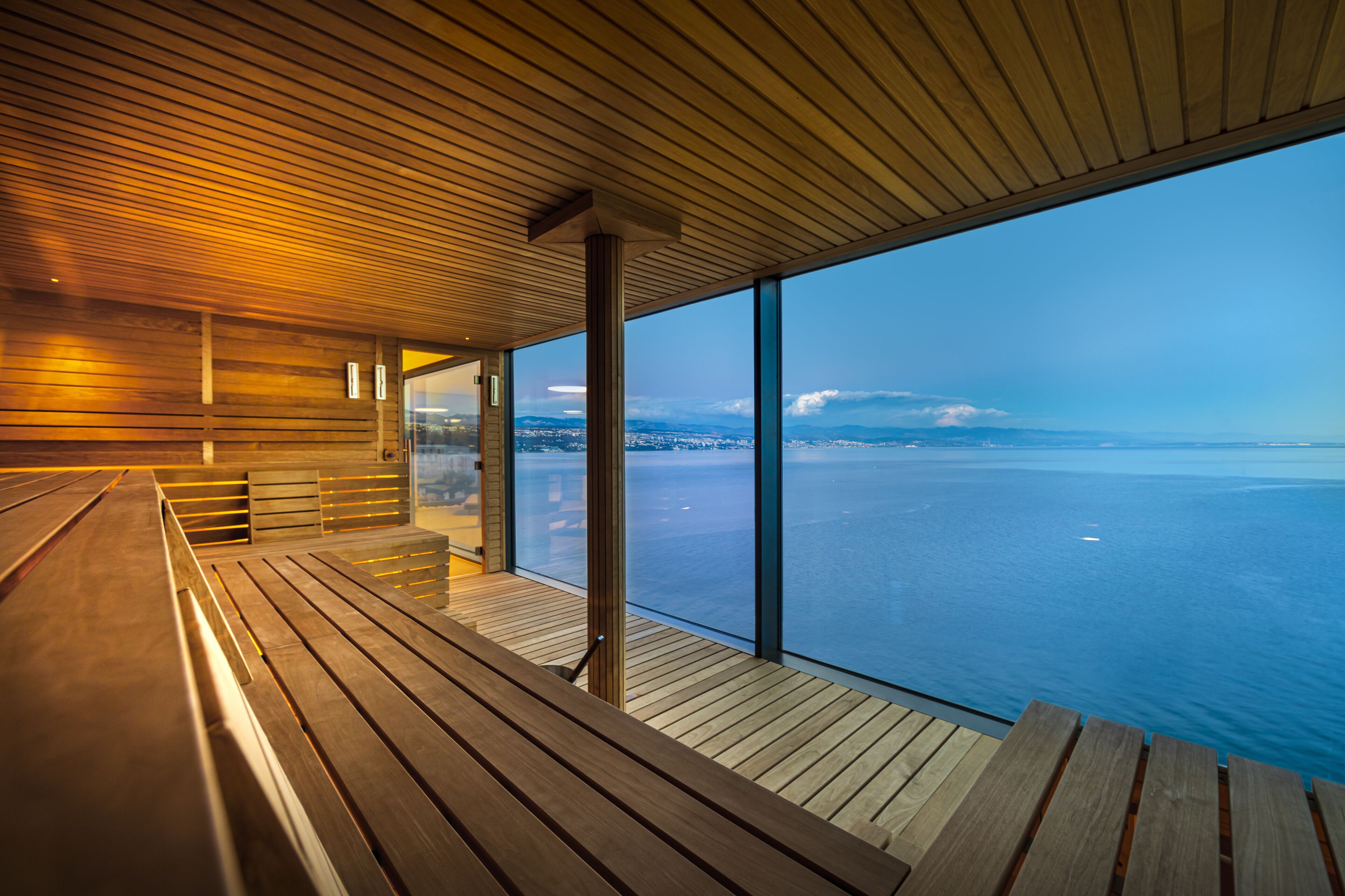 A wooden deck with a view of the ocean.