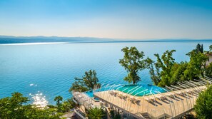 Indoor pool, seasonal outdoor pool, pool umbrellas, pool loungers