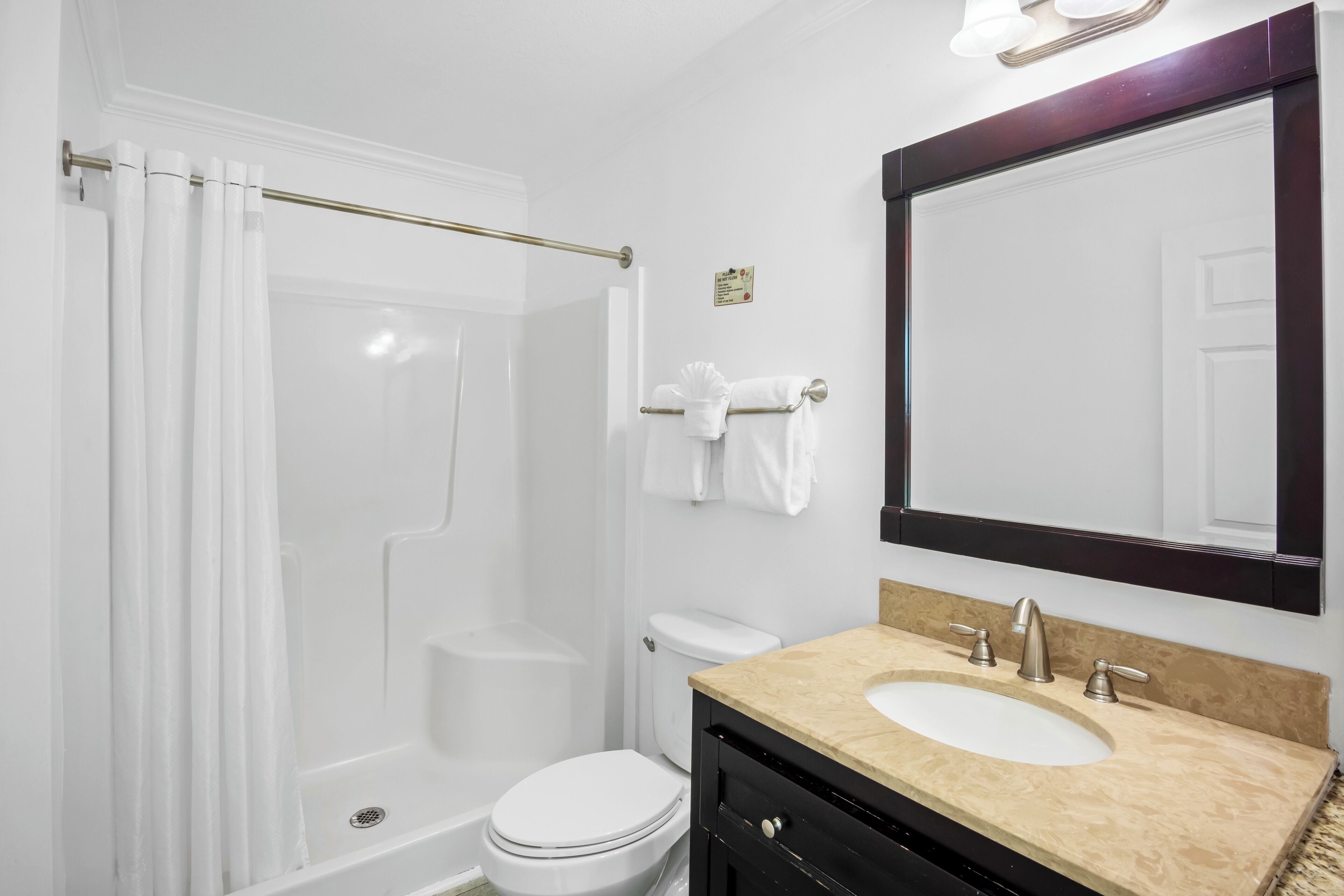 deluxe king island room | bathroom | shower, free toiletries, hair dryer, towels