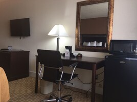 Desk, laptop workspace, blackout drapes, iron/ironing board