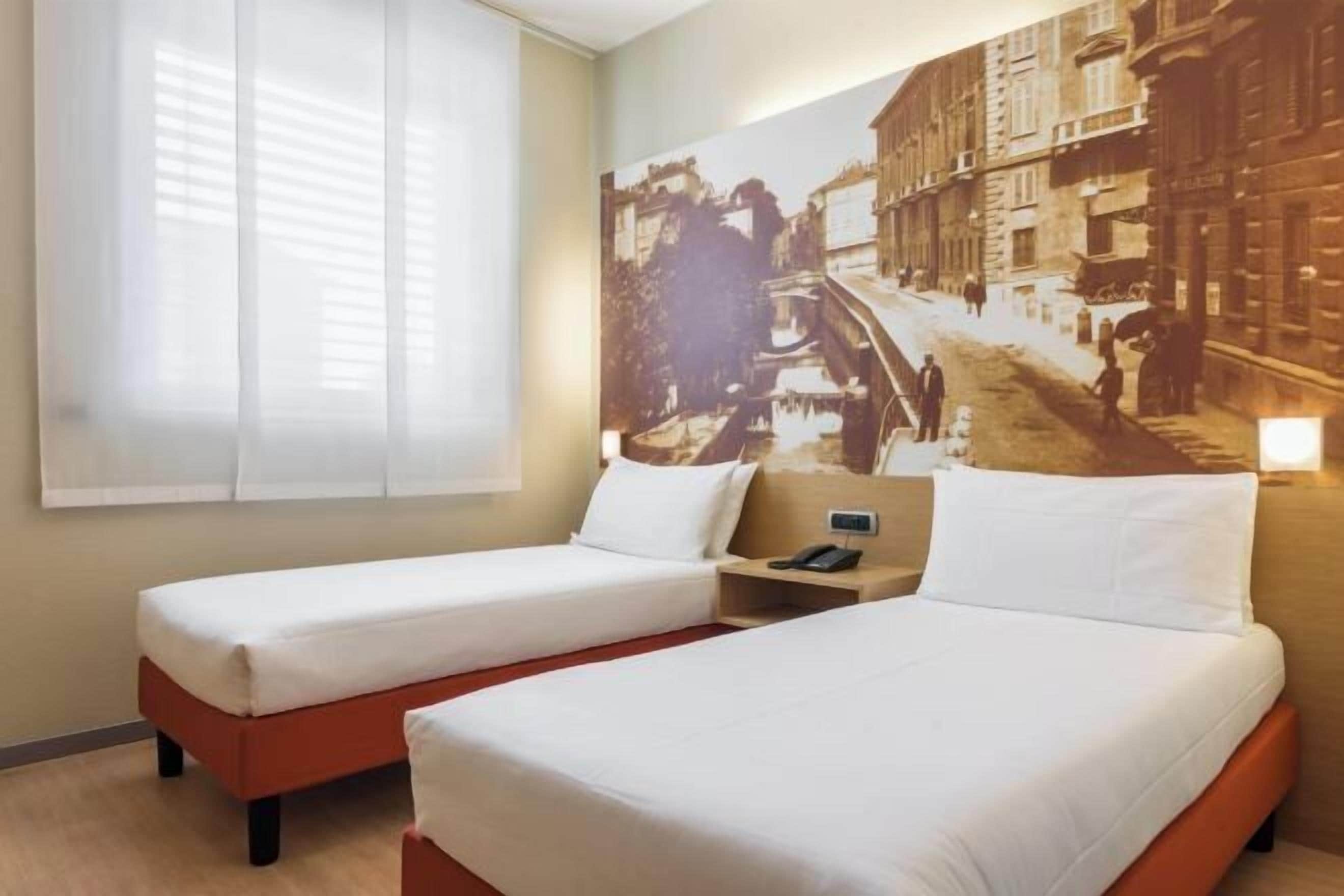 Luxe beddengoed, een minibar, een kluis op de kamer, een bureau