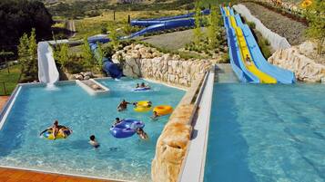 Enjoy a fun-filled day at our water park with multiple slides and a large pool area.