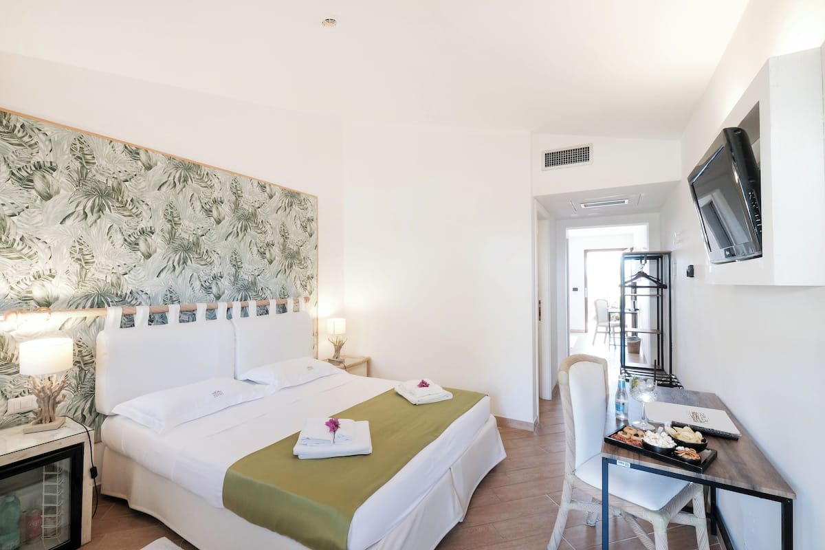 Superior Family Room | Safe på rommet, lydisolert, wi-fi (inkludert) og sengetøy