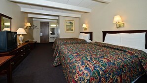 A hotel room with two beds, a television, a desk, and a bathroom. - Americas Best Value Inn Phillipsburg (Phillipsburg)