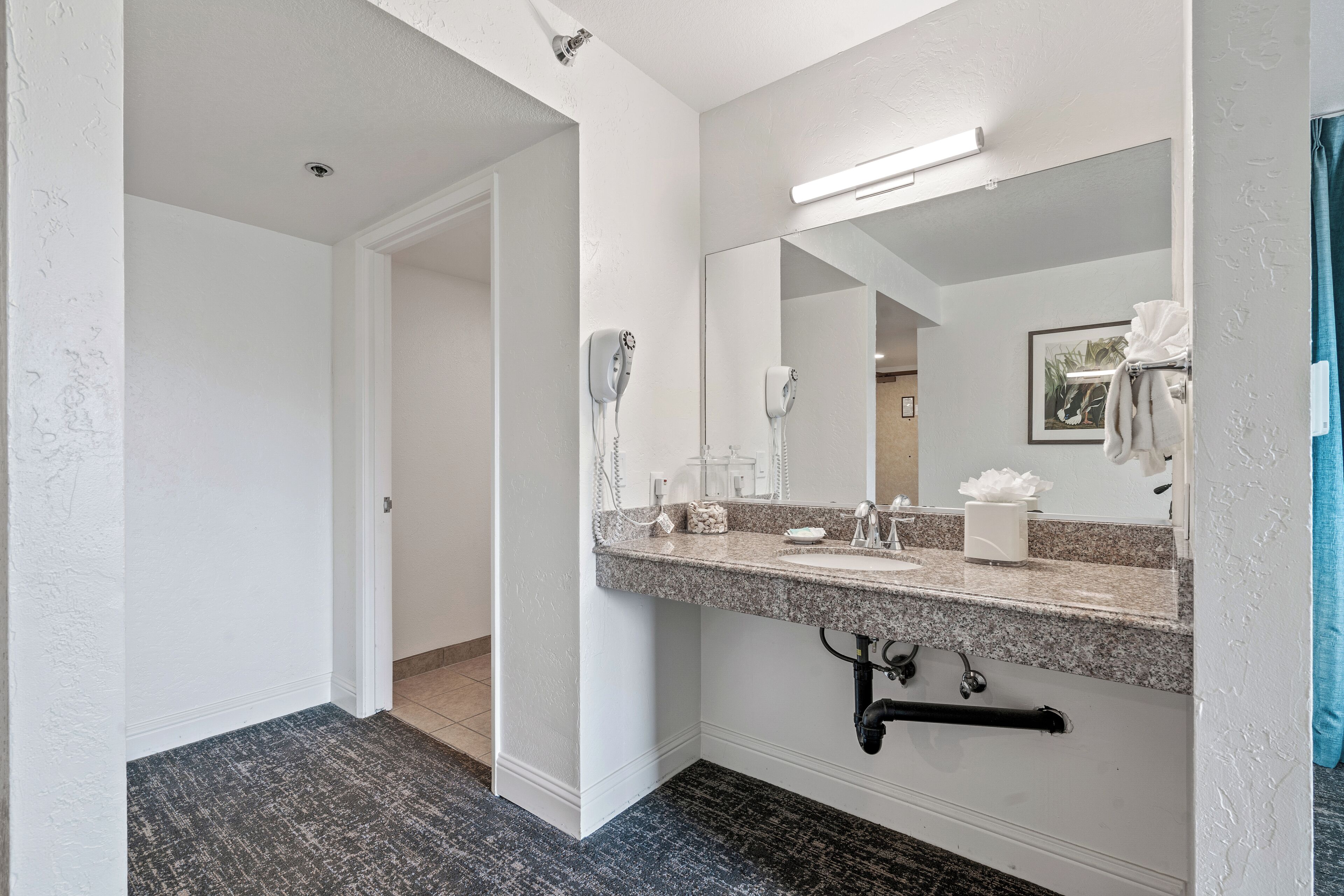 combined shower/bathtub, designer toiletries, hair dryer, towels