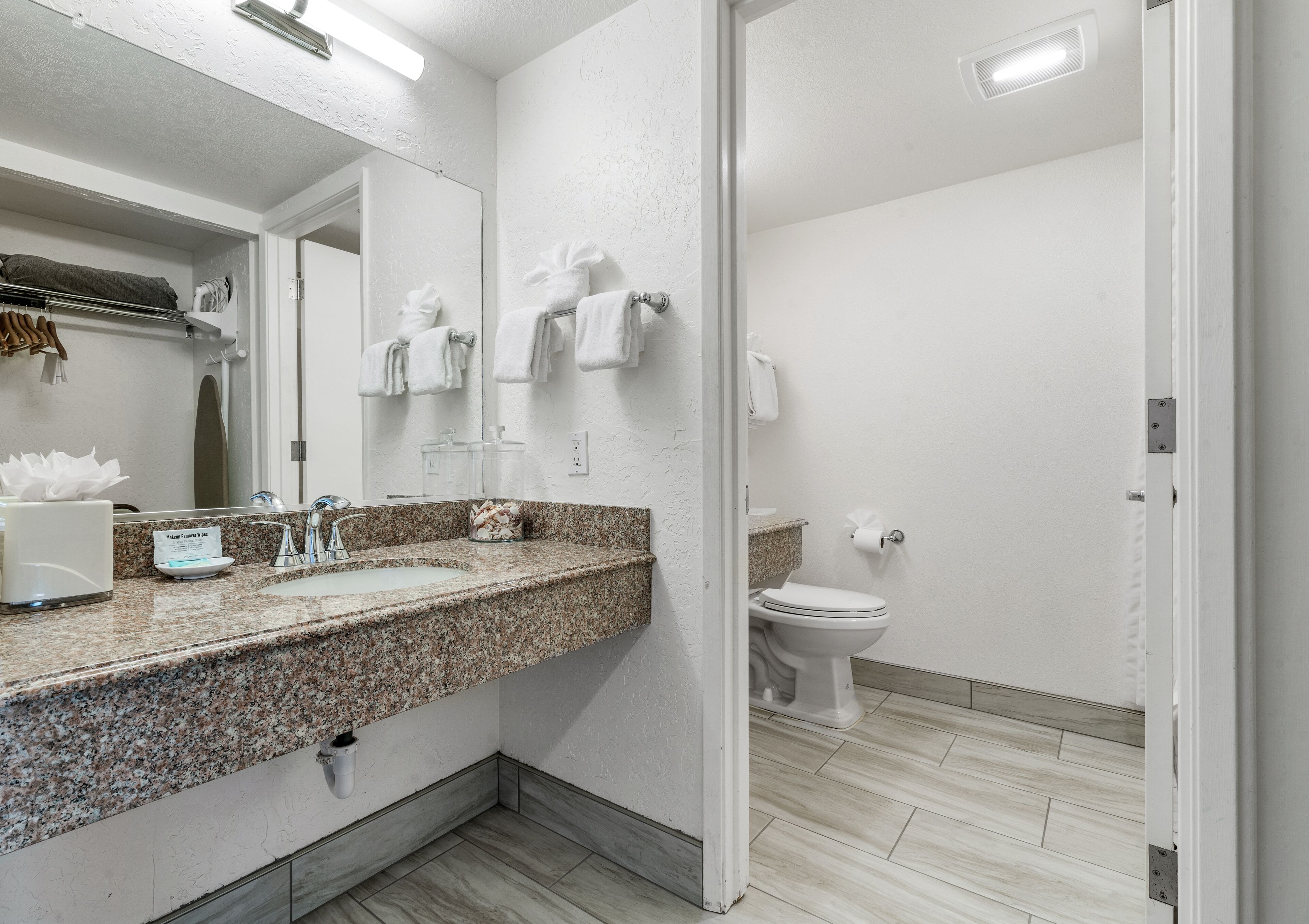 combined shower/bathtub, designer toiletries, hair dryer, towels