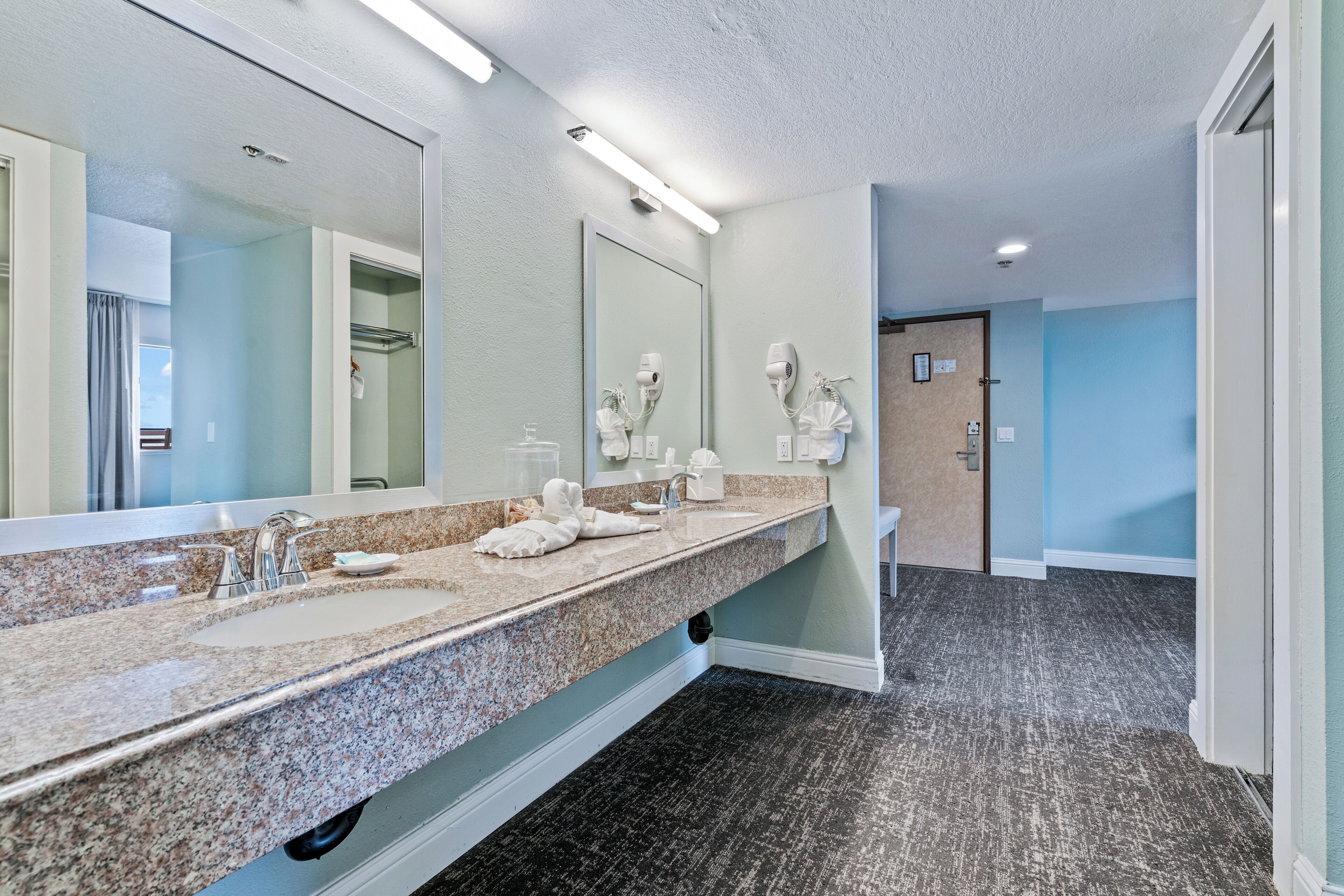 combined shower/bathtub, designer toiletries, hair dryer, towels