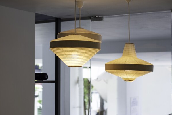 Two hanging pendant lights with a geometric design. - Harbour Ville Hotel (Singapore)