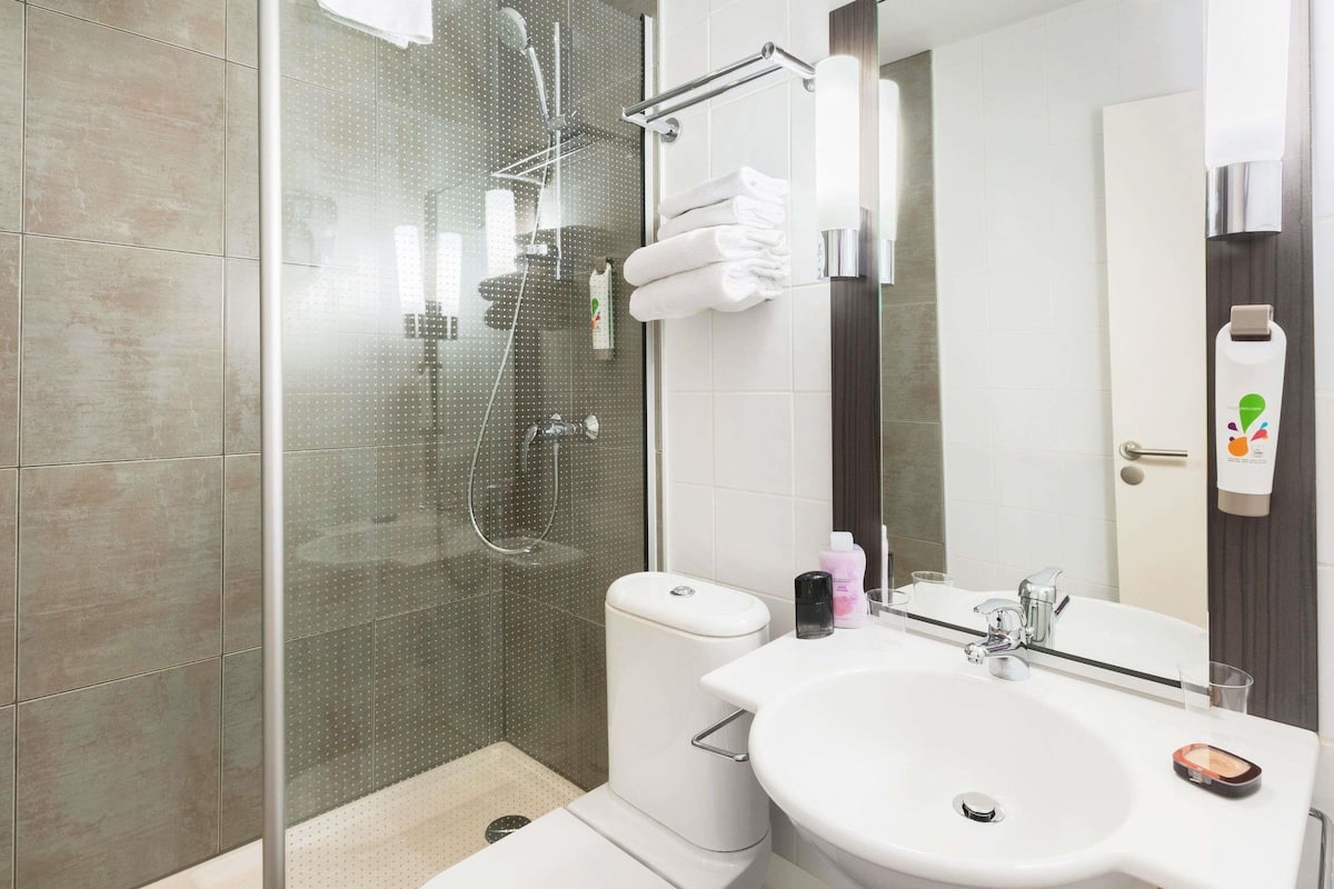 Shower, eco-friendly toiletries, hair dryer, towels