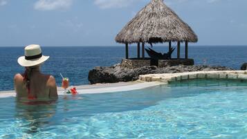 Outdoor pool, pool umbrellas, sun loungers