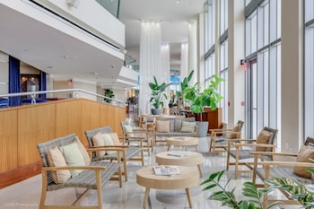 Relax in our spacious lobby, featuring comfortable seating areas and lush greenery. at Marenas Beach Resort