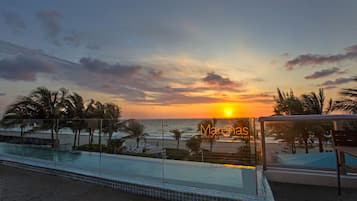 Outdoor pool, pool umbrellas, sun loungers