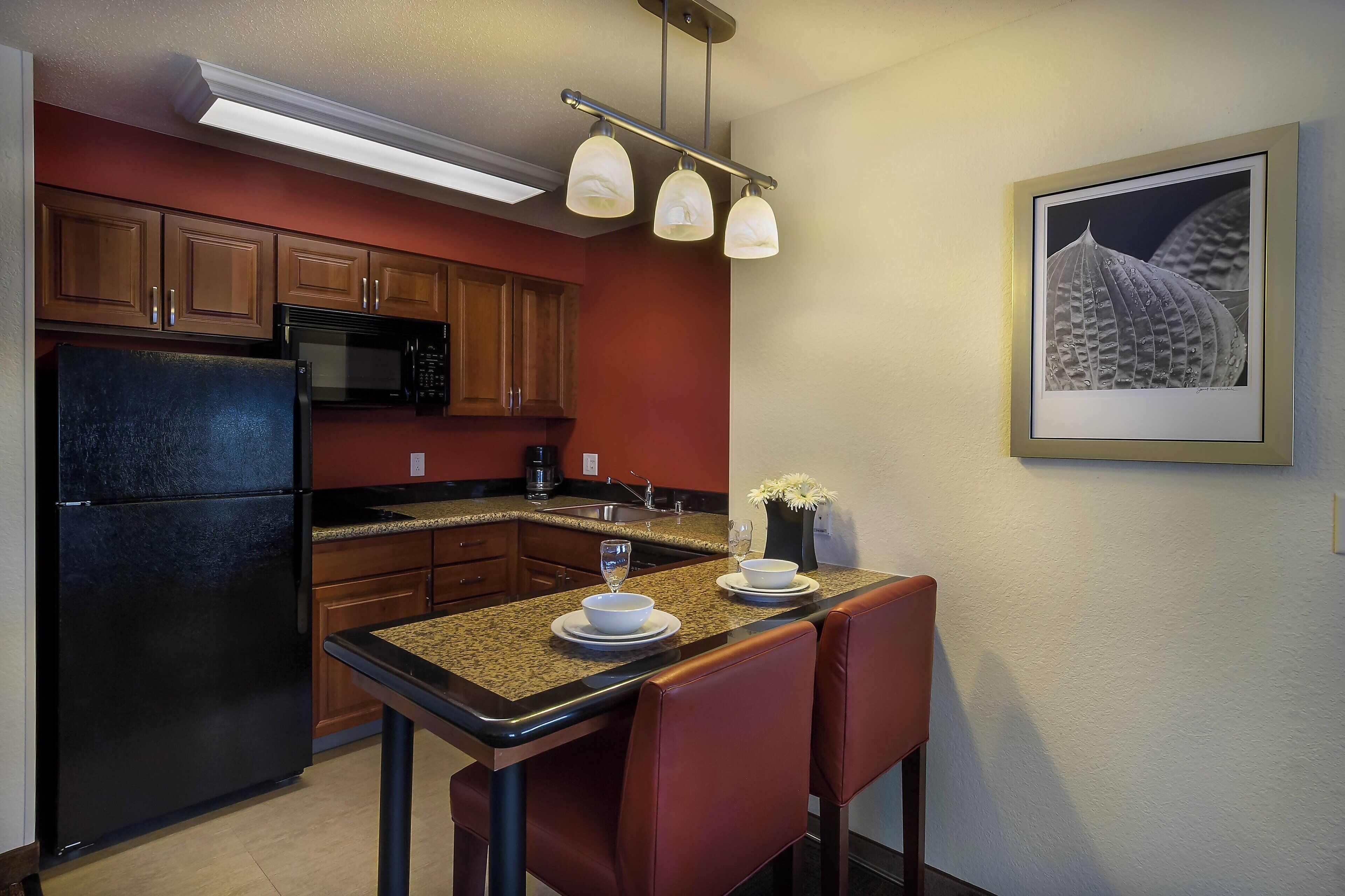 full-sized fridge, microwave, stovetop, dishwasher