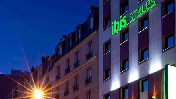 A building with a sign reading 'ibis styles' and multiple windows. - ibis Styles Paris Porte d’Orléans Hotel (Montrouge)