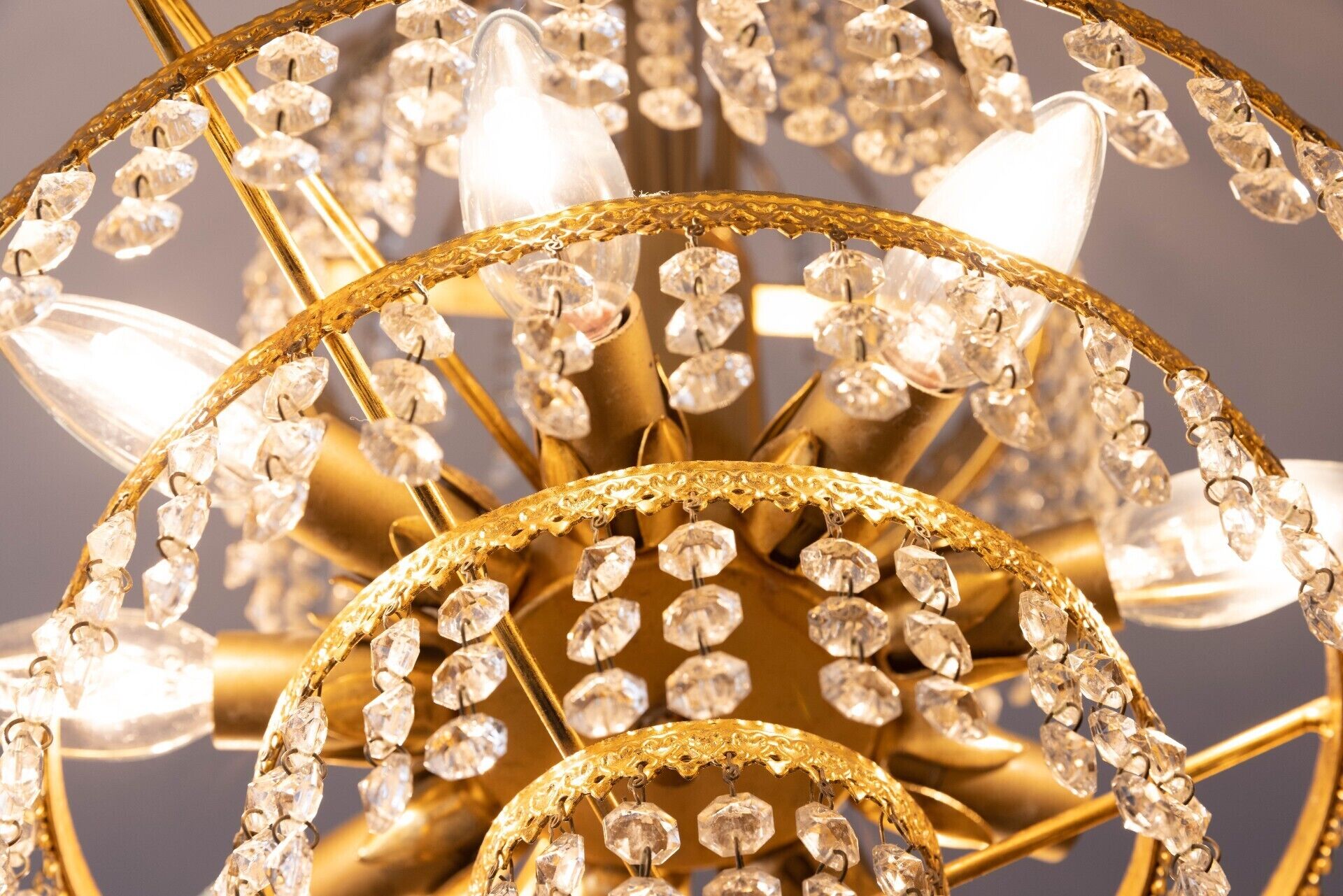 A chandelier with multiple tiers of crystal decorations.