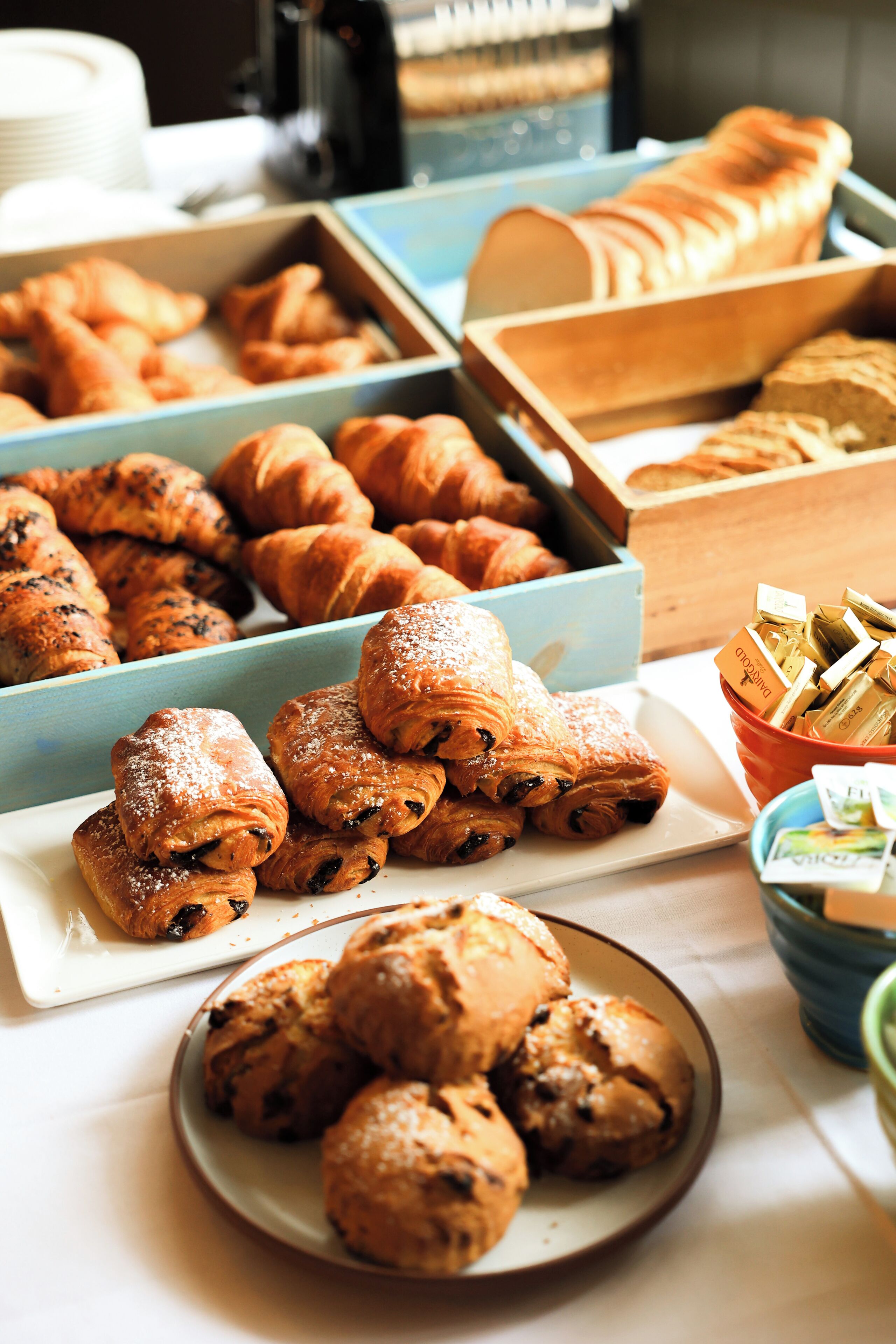 A variety of pastries and baked goods displayed on a table.