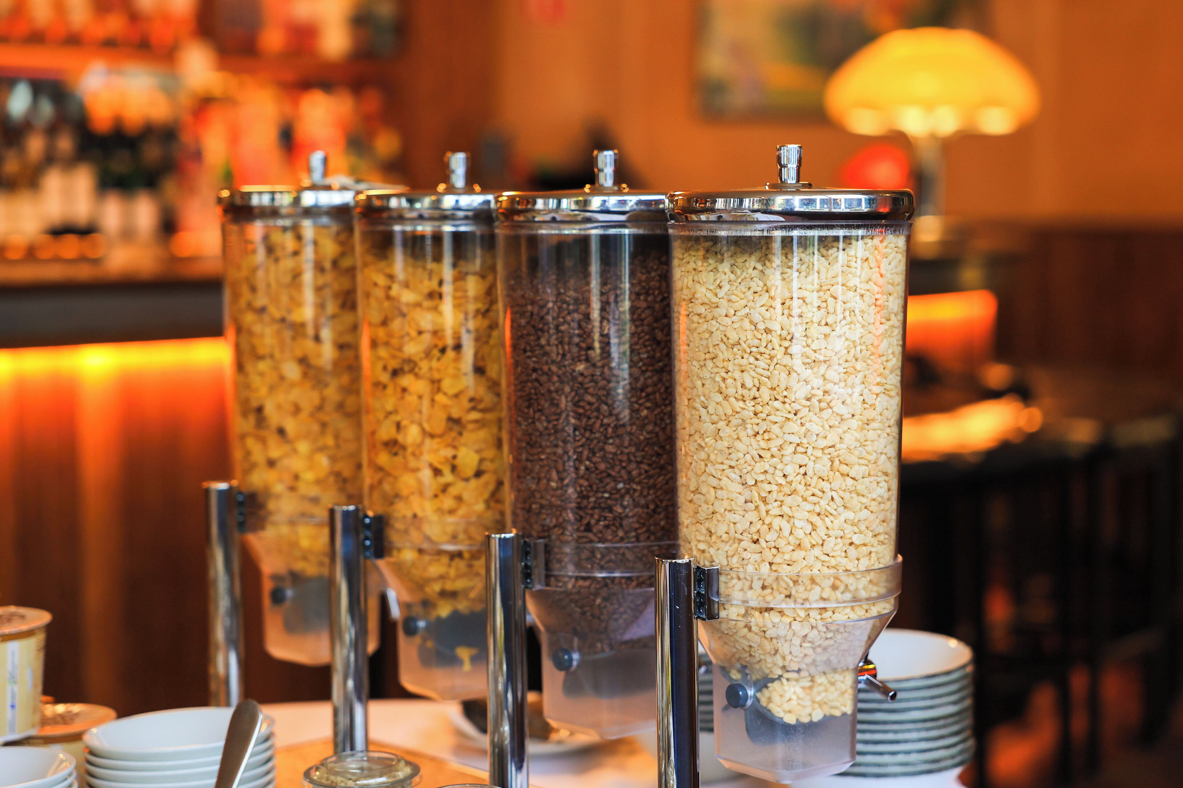 A buffet with various food containers.