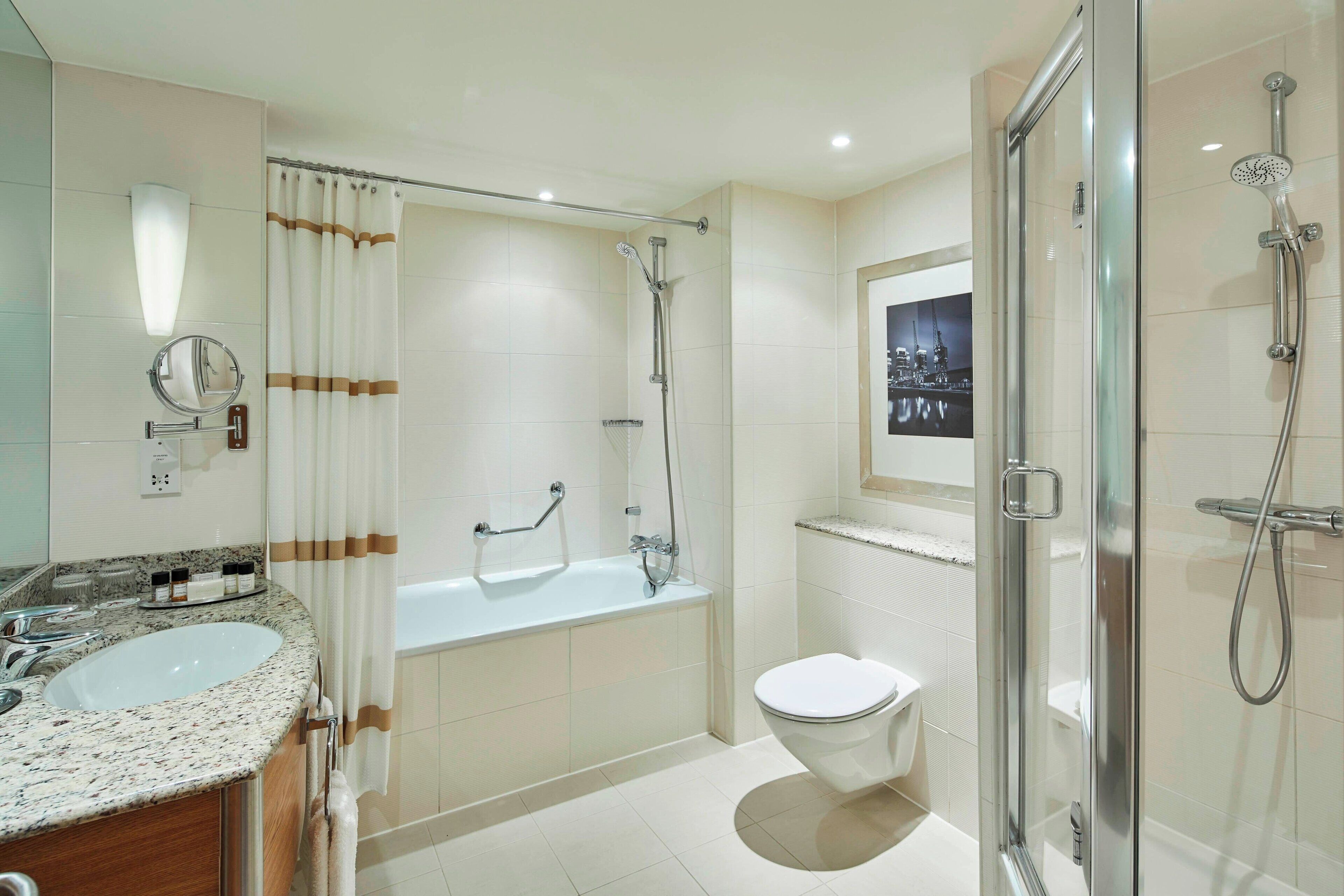 executive studio suite, 1 king bed | bathroom | combined shower/bathtub, deep-soaking bathtub, free toiletries