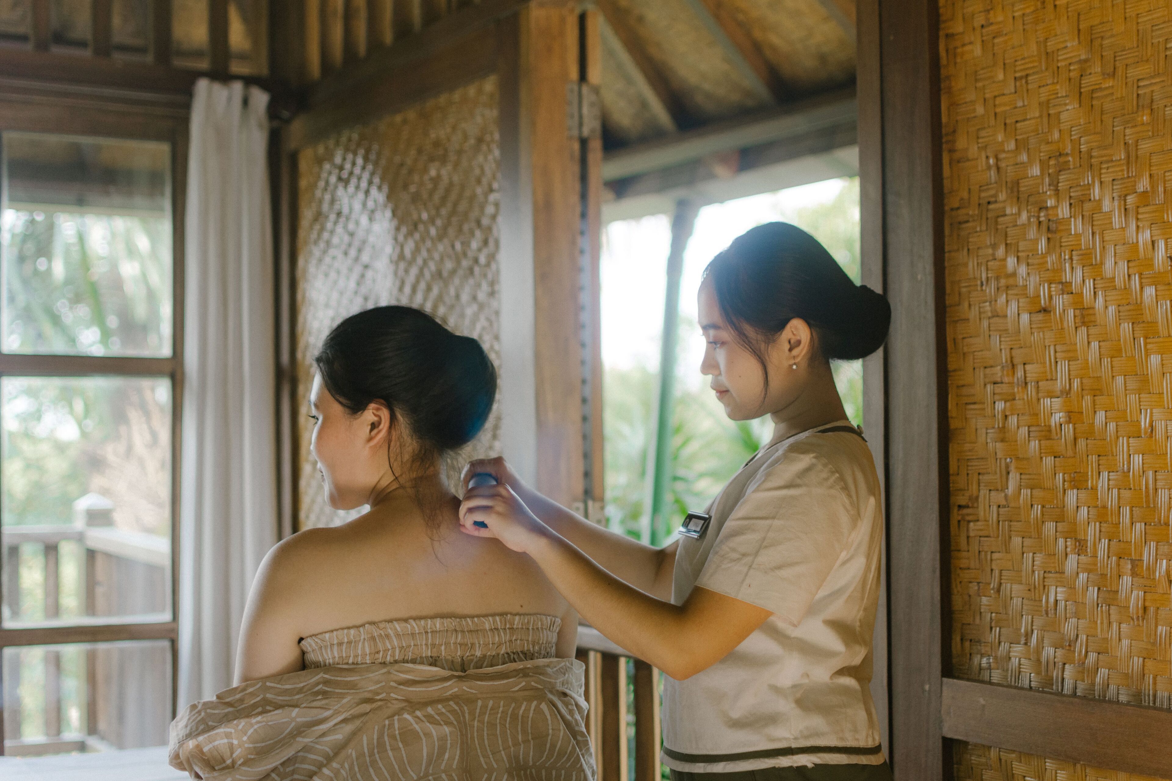 A room with a wooden ceiling and a woven wall.