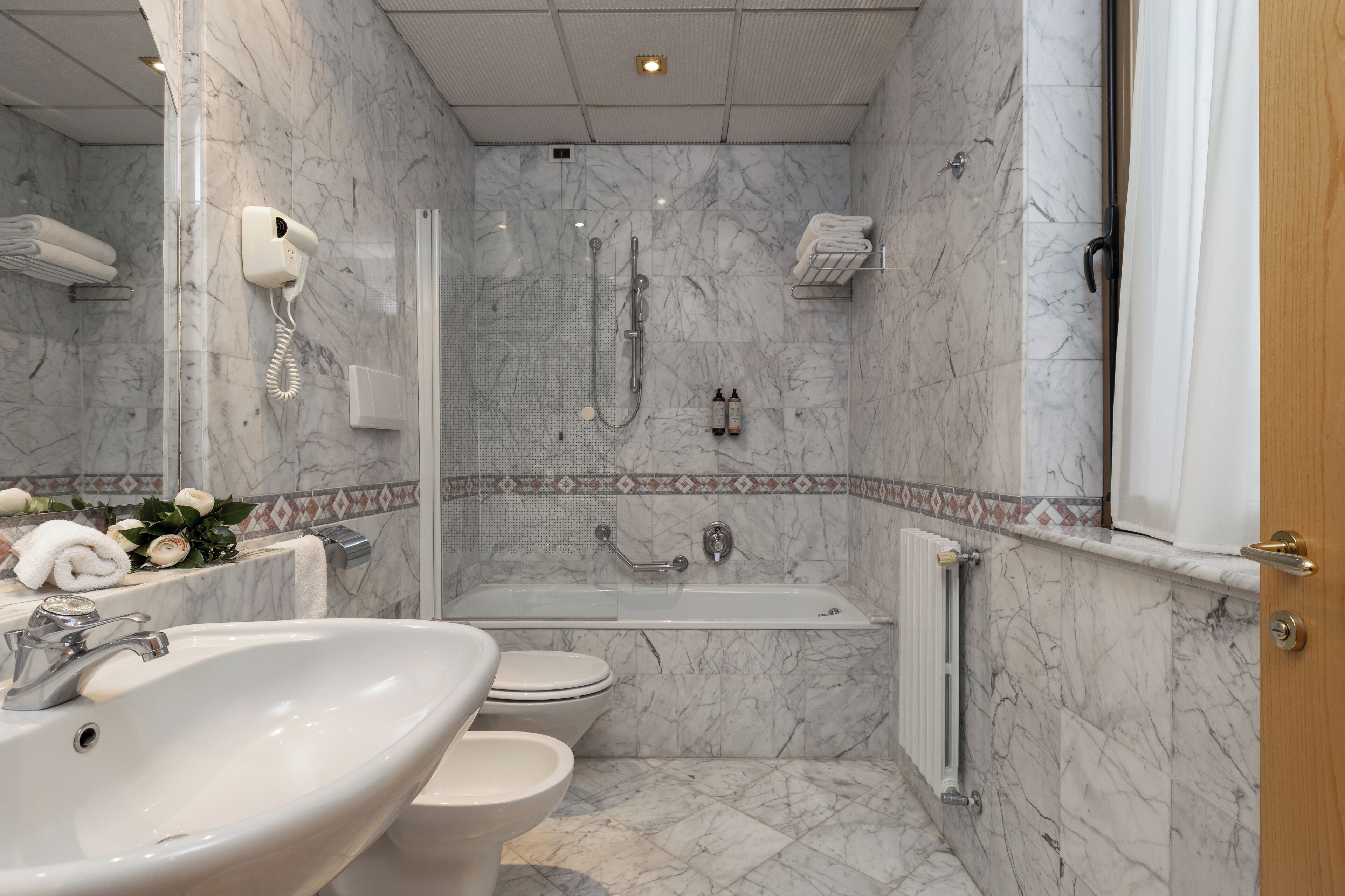 junior suite | bathroom | shower, free toiletries, hair dryer, bidet