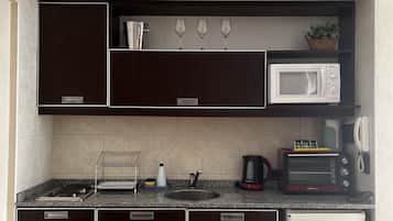 Mini-fridge, microwave, electric kettle, toaster