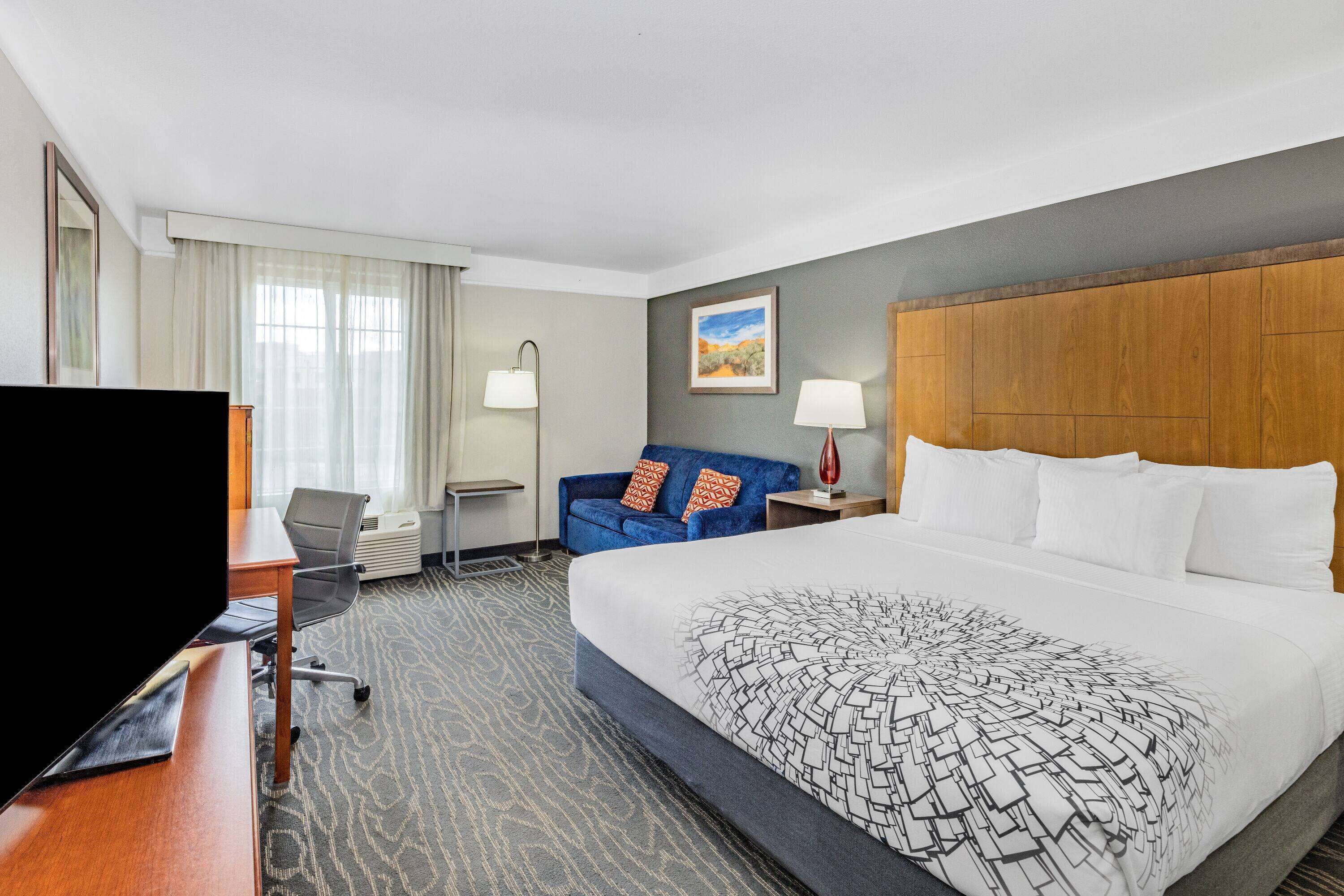 premium bedding, pillow-top beds, desk, laptop workspace