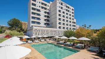 Seasonal outdoor pool, open 10:00 AM to 6:00 PM, pool umbrellas