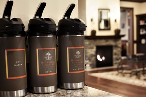 Three insulated water bottles labeled 'Highridge Country Reserve' on a kitchen counter.