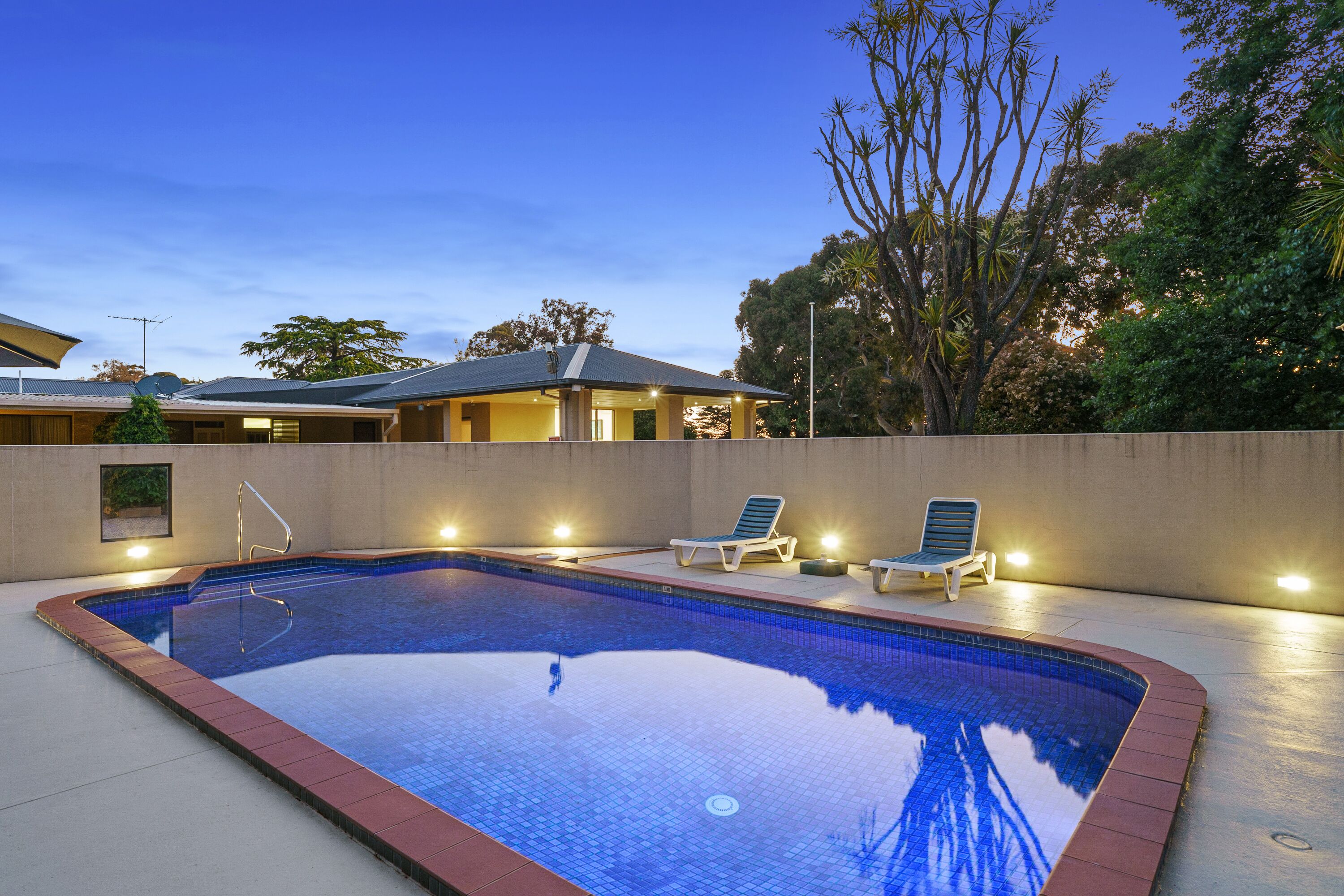 outdoor pool, pool umbrellas, pool loungers