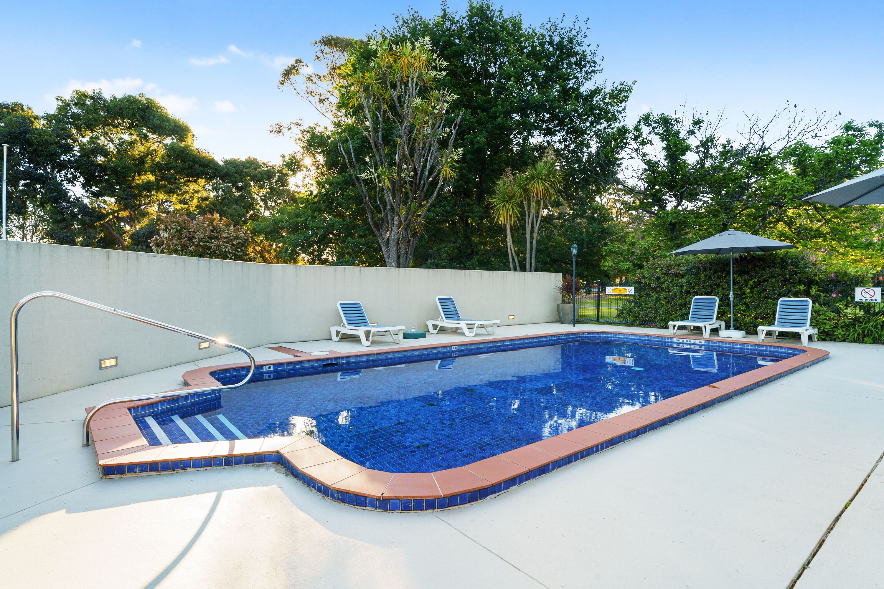 outdoor pool, pool umbrellas, pool loungers