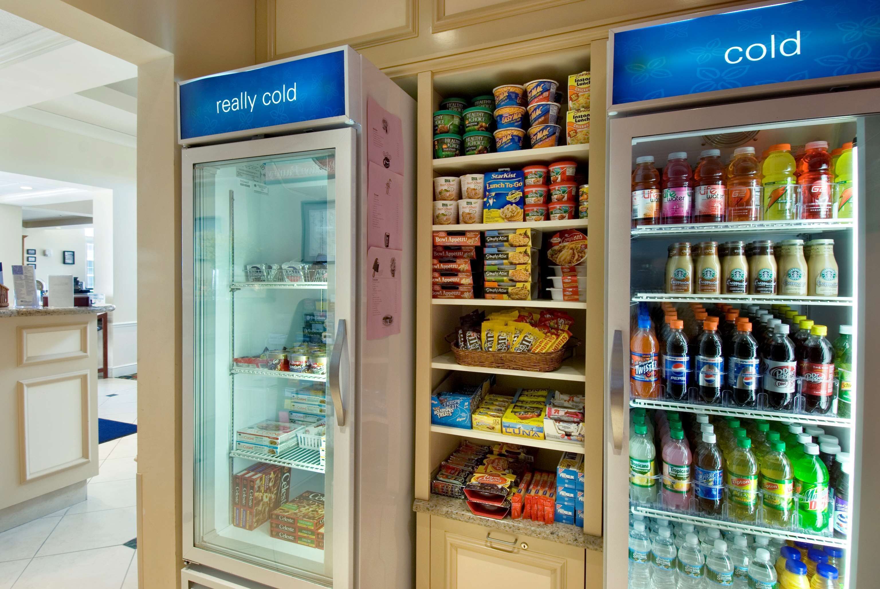 A vending machine stocked with snacks and beverages, including StarKist and Tropicana products.