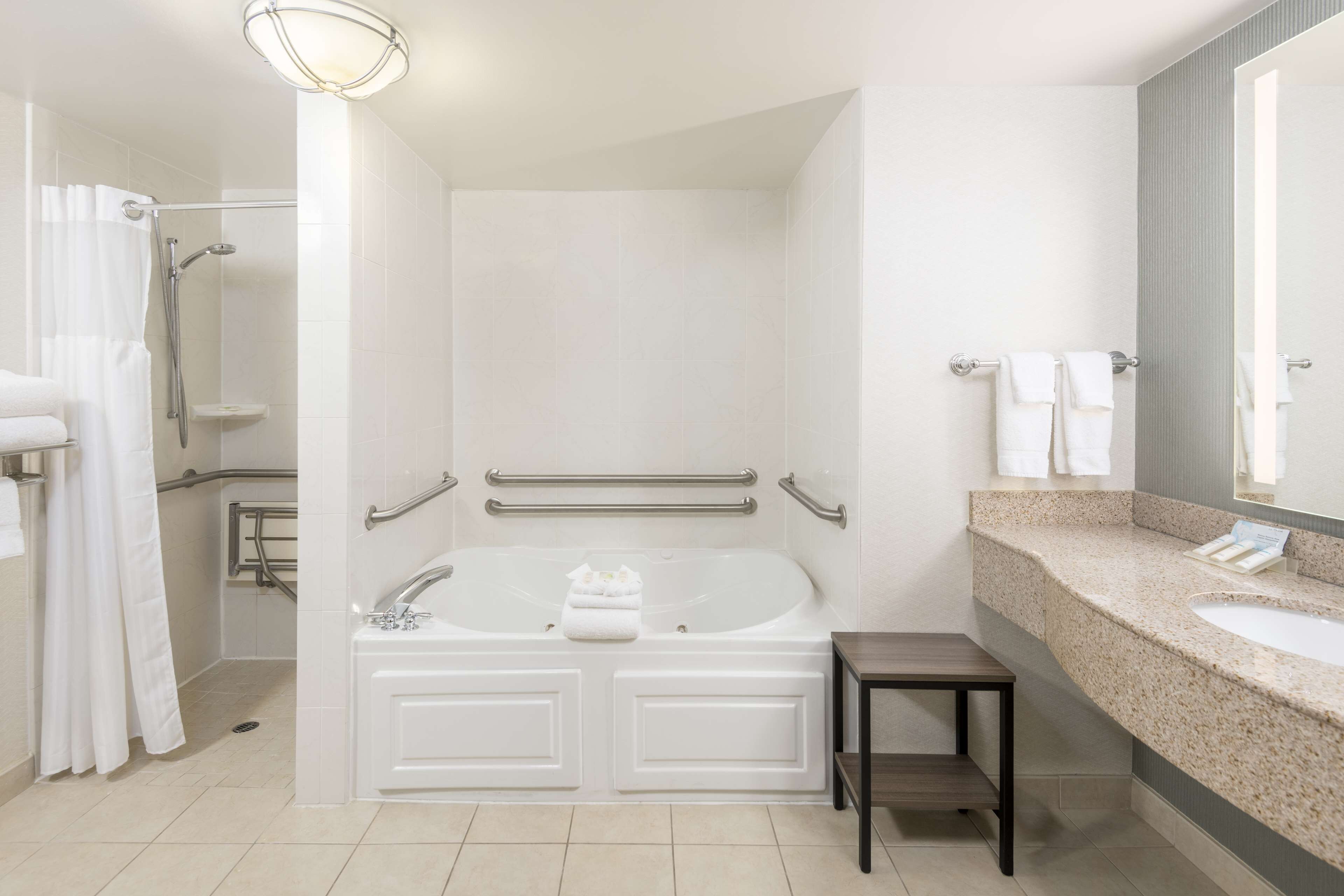 suite | bathroom | combined shower/bathtub, designer toiletries, hair dryer, towels