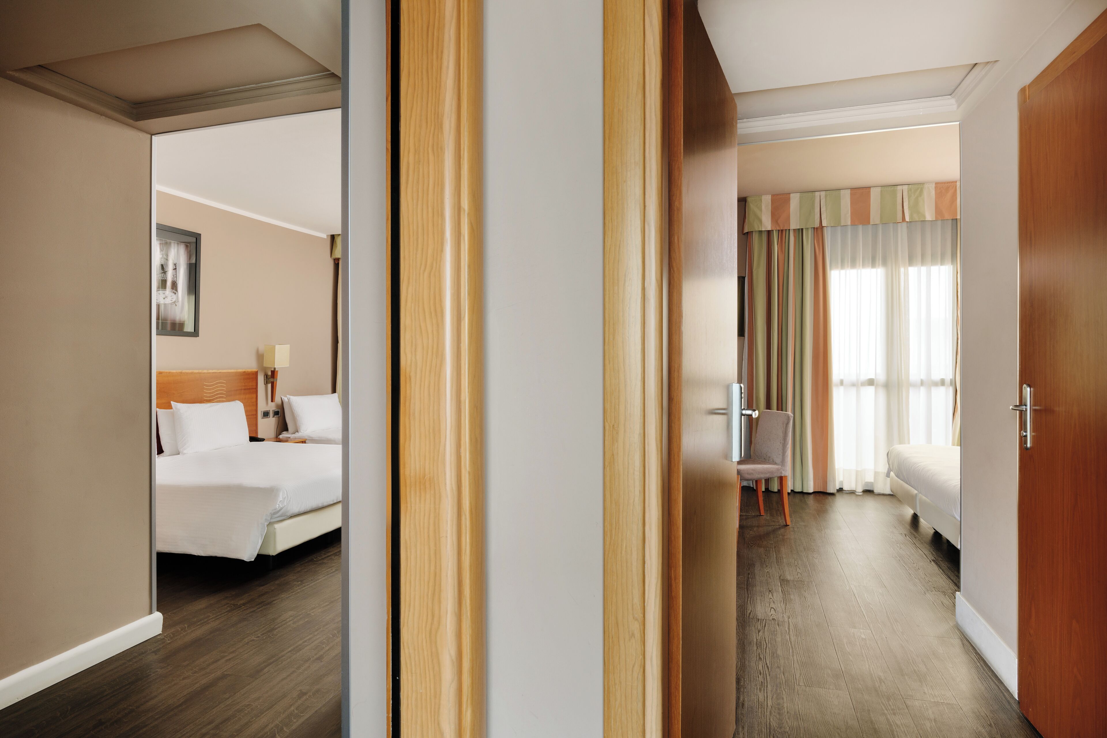 family room | 1 bedroom, minibar, in-room safe, desk