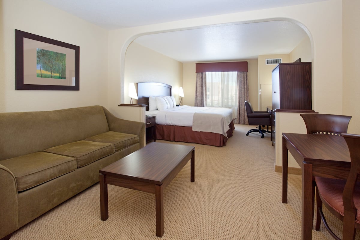 Suite, 1 King Bed (Additional Living and Dining Area) | Hypo-allergenic bedding available, in-room safe, desk, blackout drapes