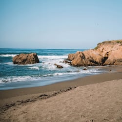 Guests can enjoy access to the sandy beach and scenic ocean views.