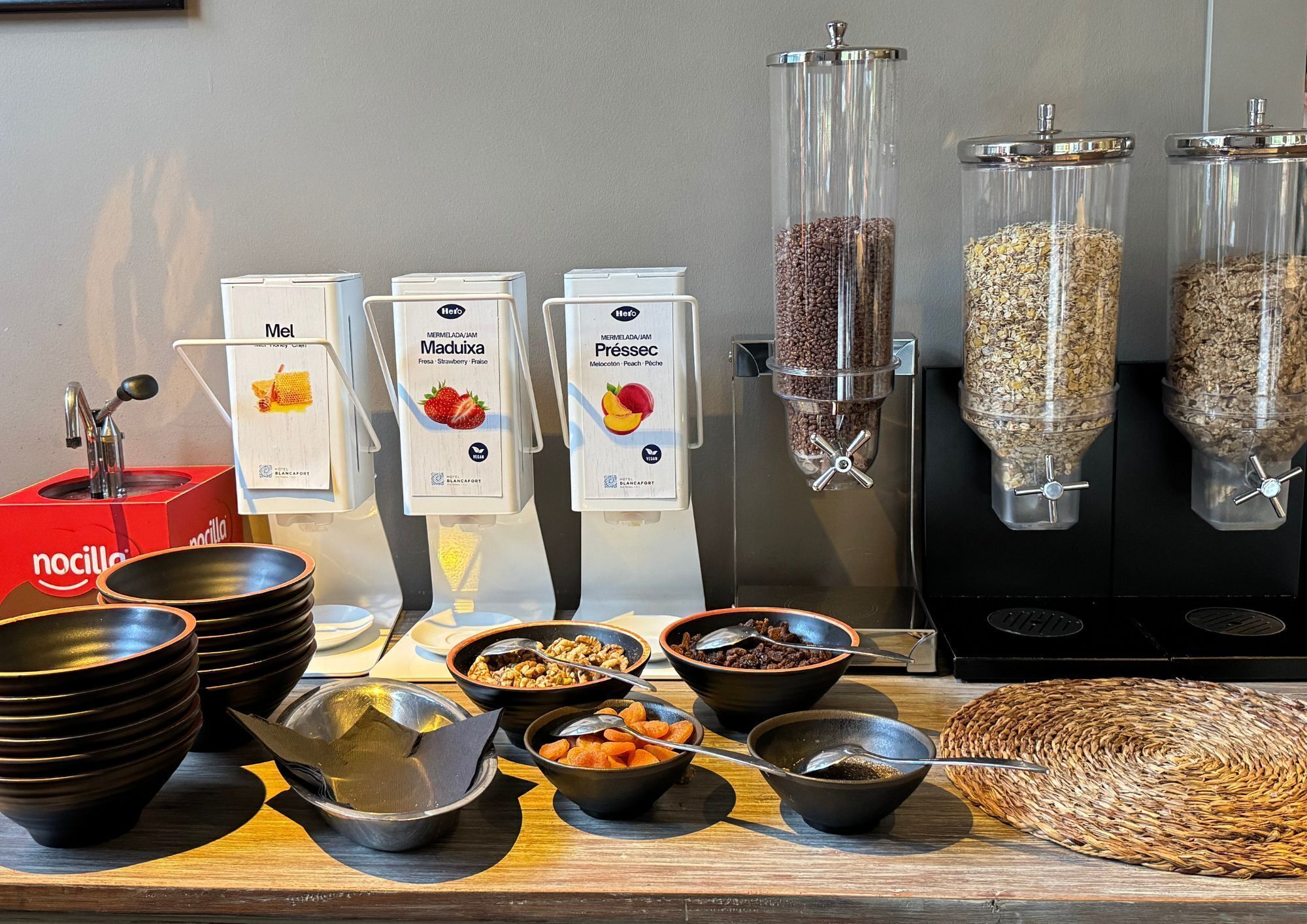 A breakfast buffet with various food options and serving stations.
