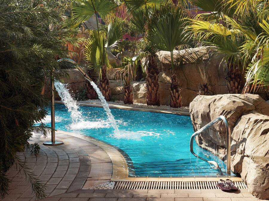 Indoor pool, outdoor pool, pool umbrellas, pool loungers