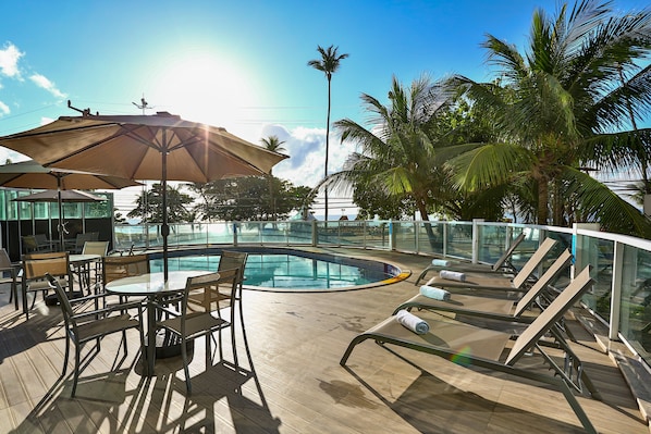 Outdoor pool, pool umbrellas, sun loungers