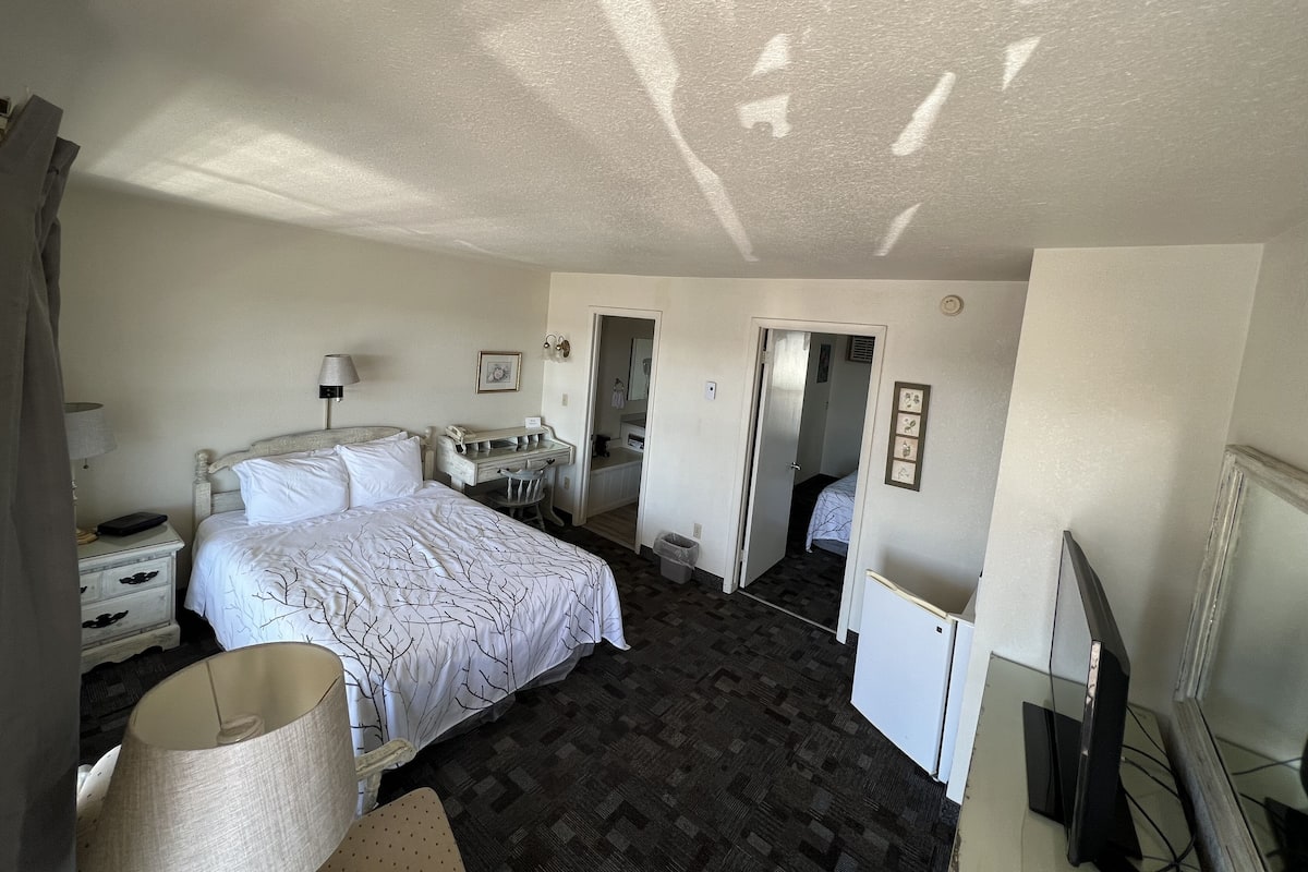 Standard Suite, 2 Bedrooms | Desk, blackout drapes, iron/ironing board, free WiFi